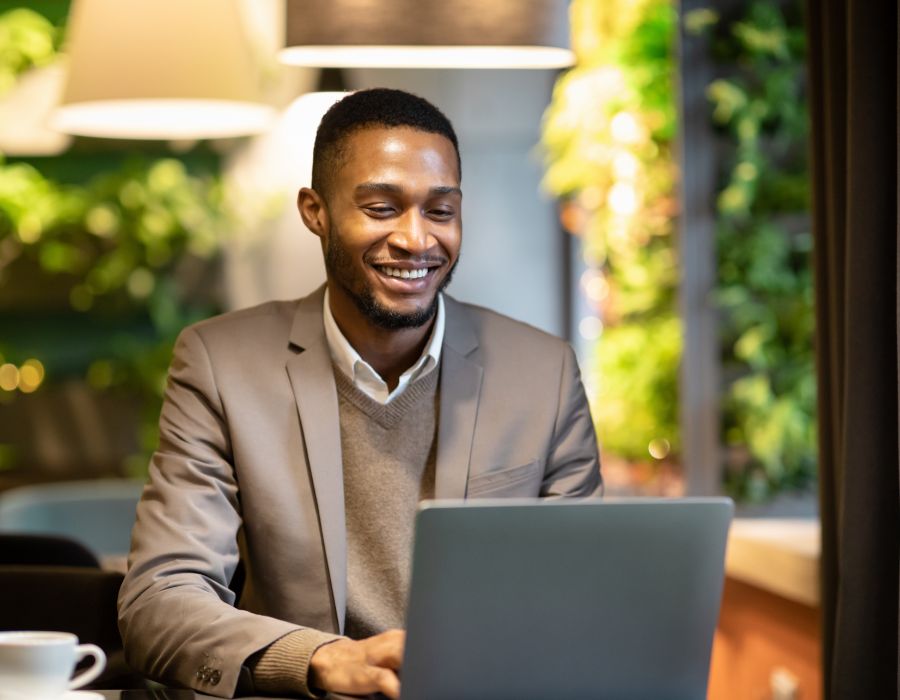 Smiling man at computer